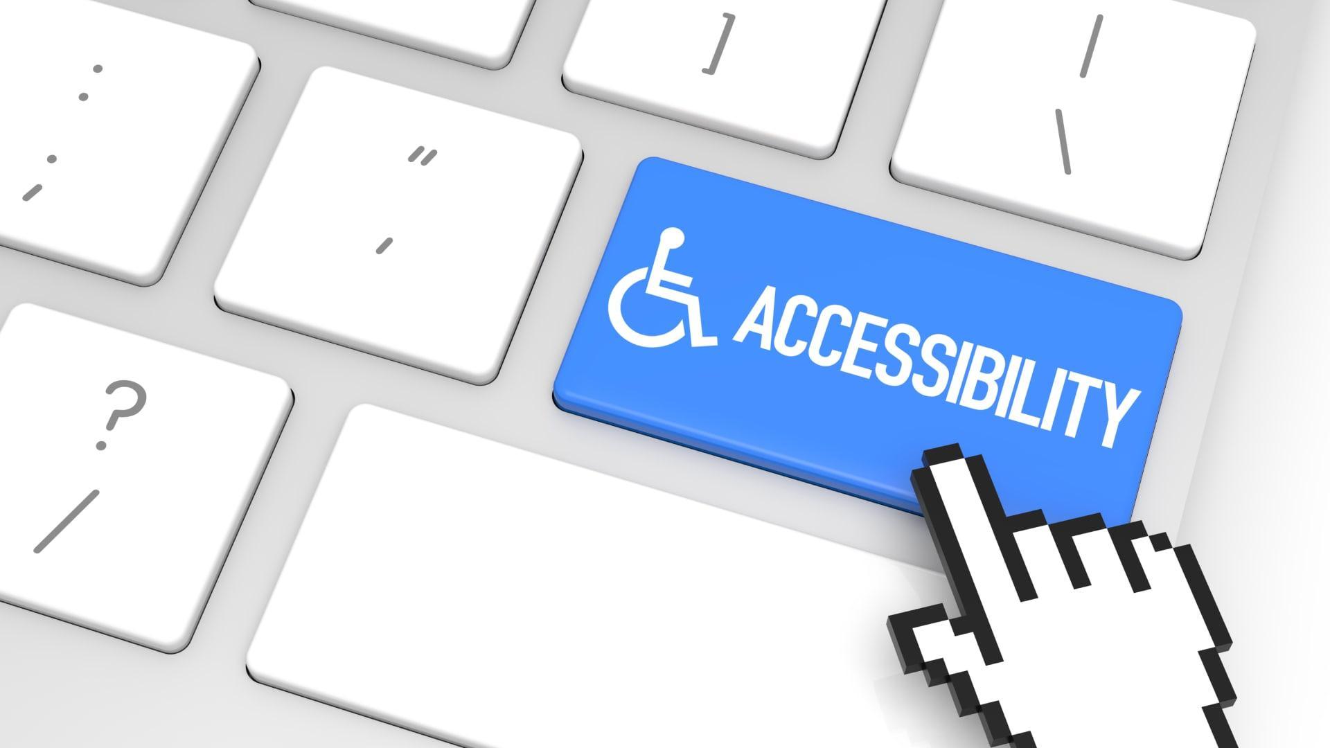 Accessibility key on a keyboard highlighted in blue with a cursor icon, symbolizing website accessibility.