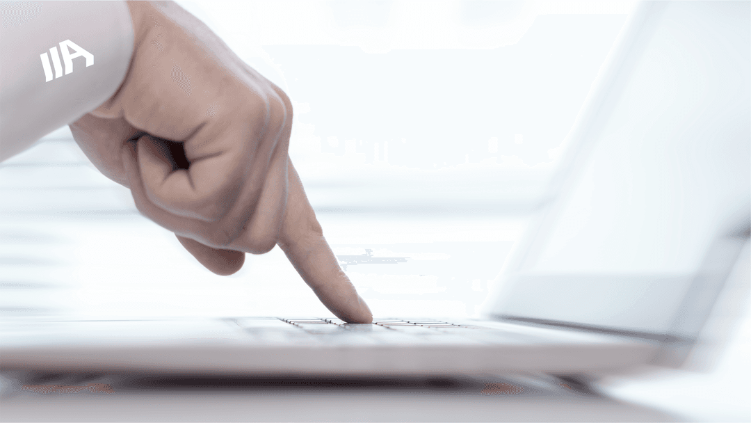 A close-up of a hand pressing a key on a laptop keyboard, symbolizing digital interaction and accessibility.