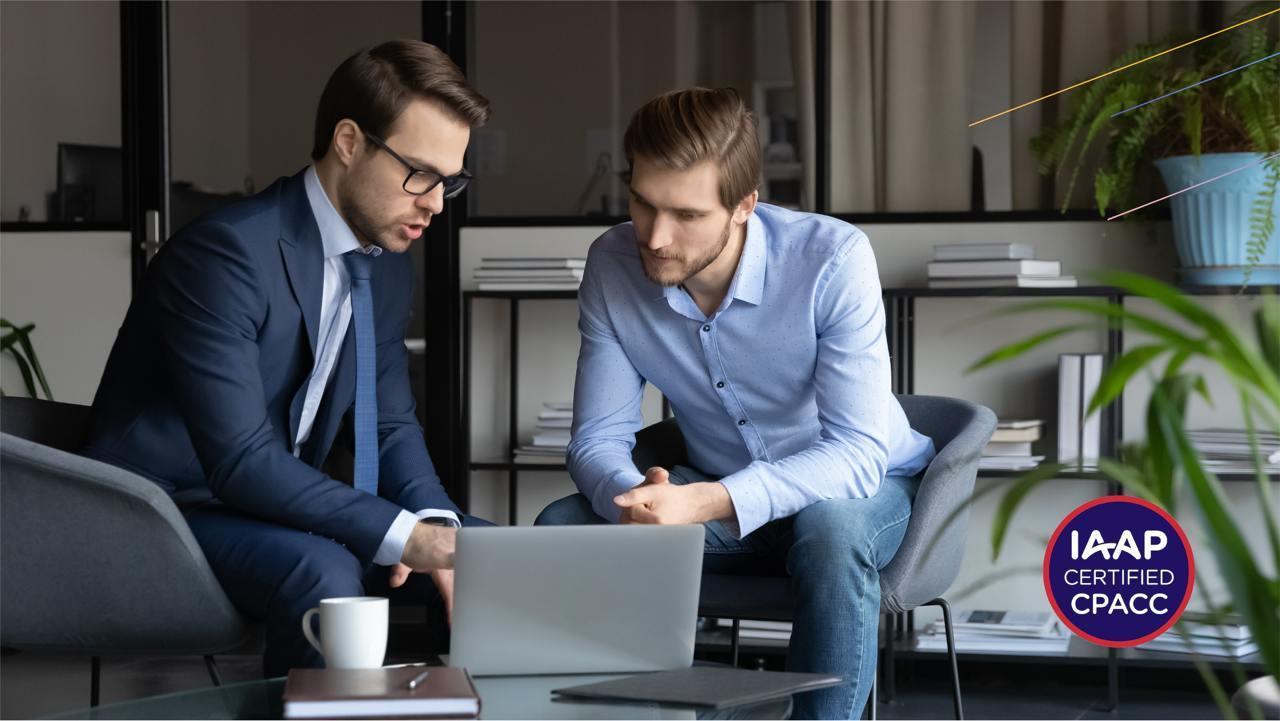 two cpacc specialists are looking at the computer